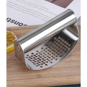 ￼ Stainless steel, garlic press, kitchen tool